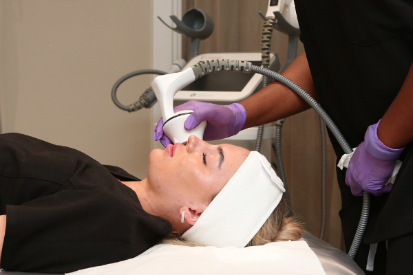 client having face and body contouring treatment
